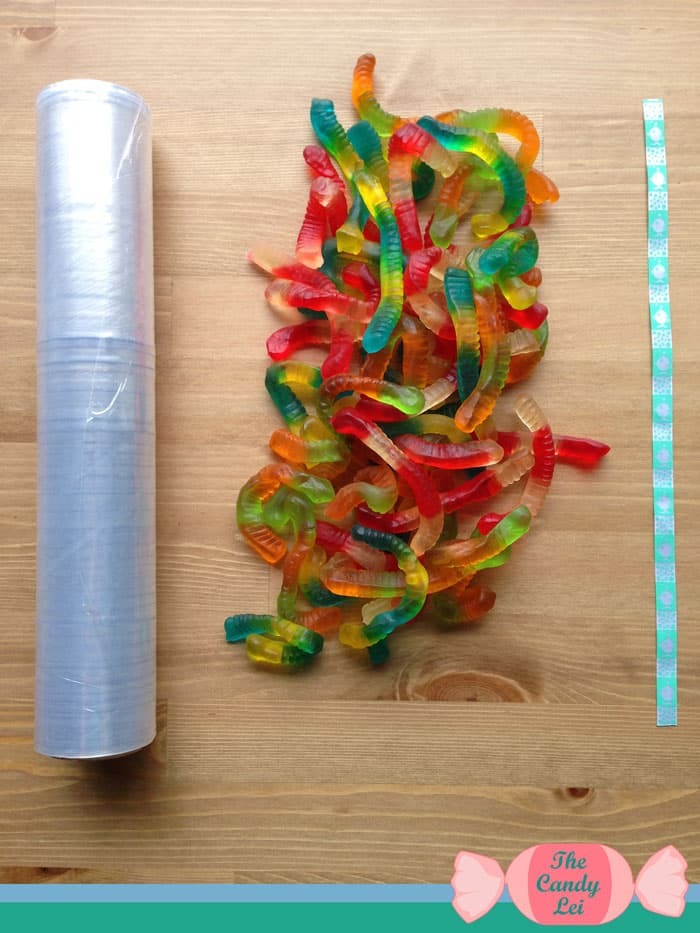 Materials to make a gummy worm candy lei