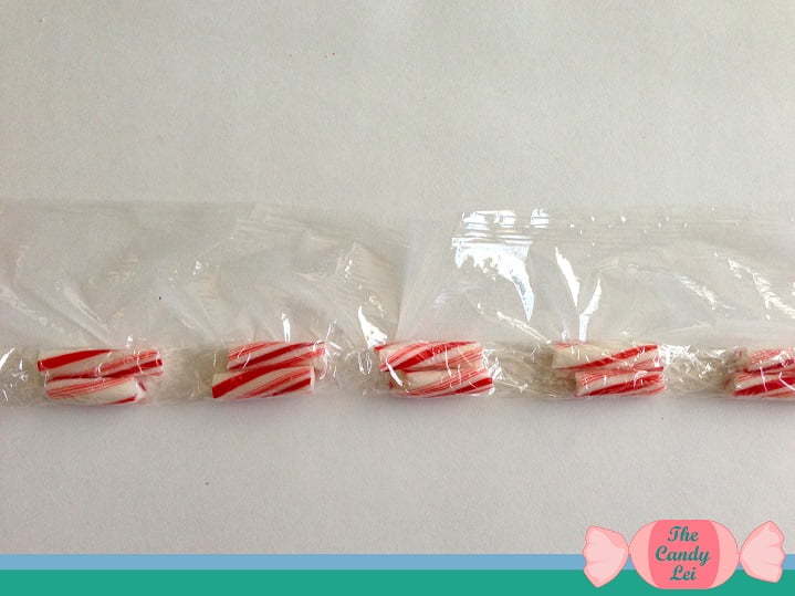 Roll up candy canes in saran wrap