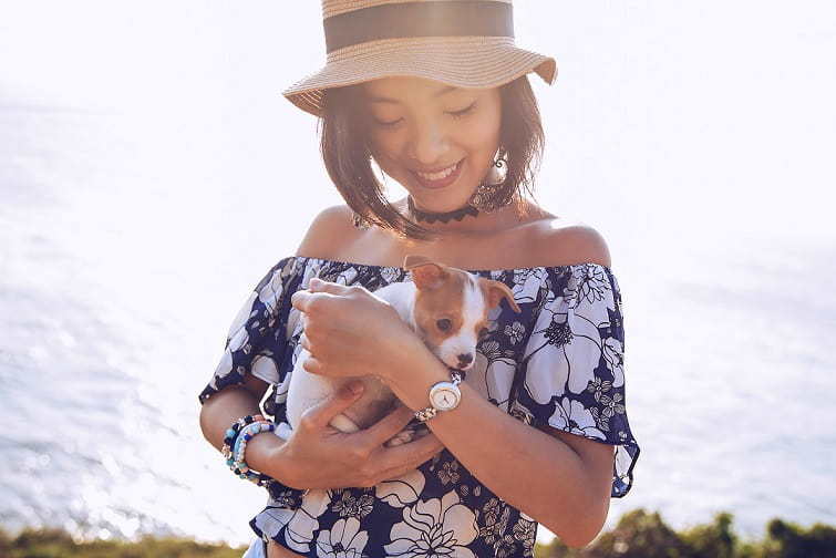 Cute senior picture of a girl and her little puppy