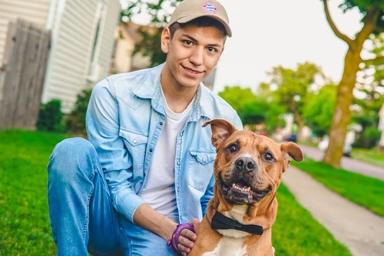 Cute dog and teen in a senior picture