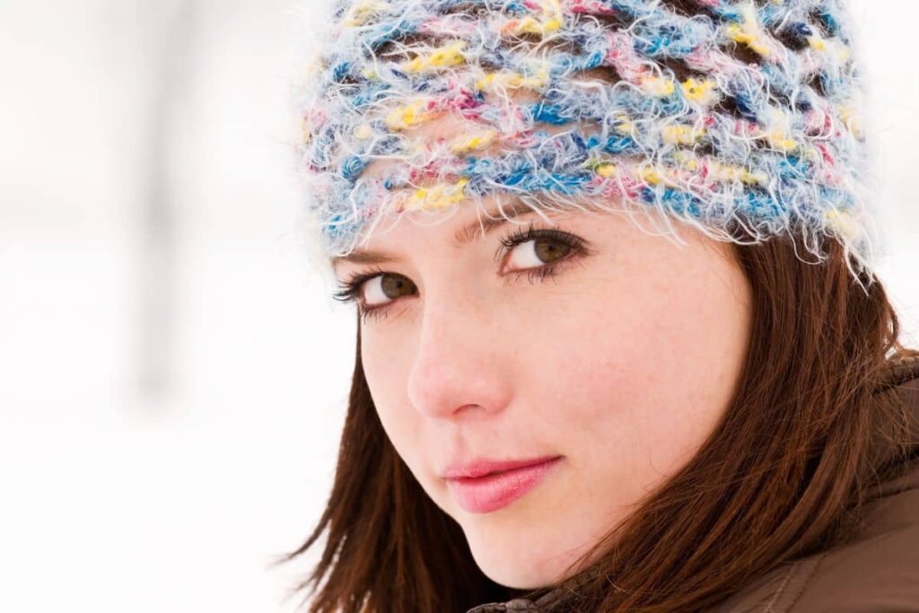 headshot of women in the snow for senior picture ideas