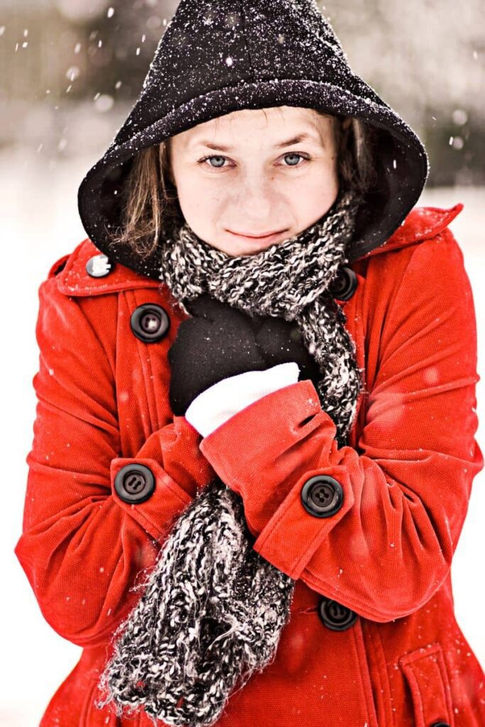 cold women in snow for senior picture