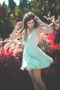 women spinning in a dress for senior portrait