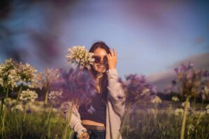 spring senior picture with large flowers