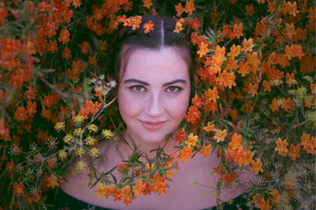senior picture with orange flowers