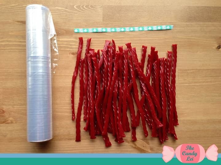 Materials to make a twizzlers candy lei