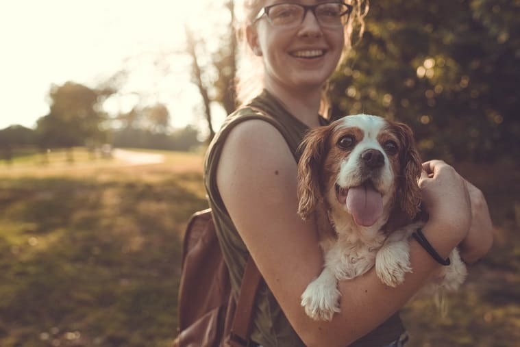 Outdoors picture of a girl and her dog